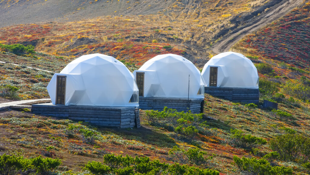 What is a Prefab Home? A Modern Solution for Housing Needs. A single-deck space capsule home on the slope of a volcano in autumn on the Kamchatka Peninsula