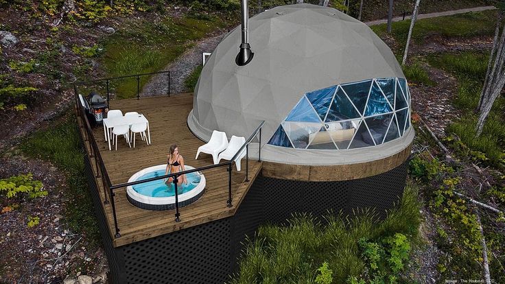 dome house with a deck and a plunge pool